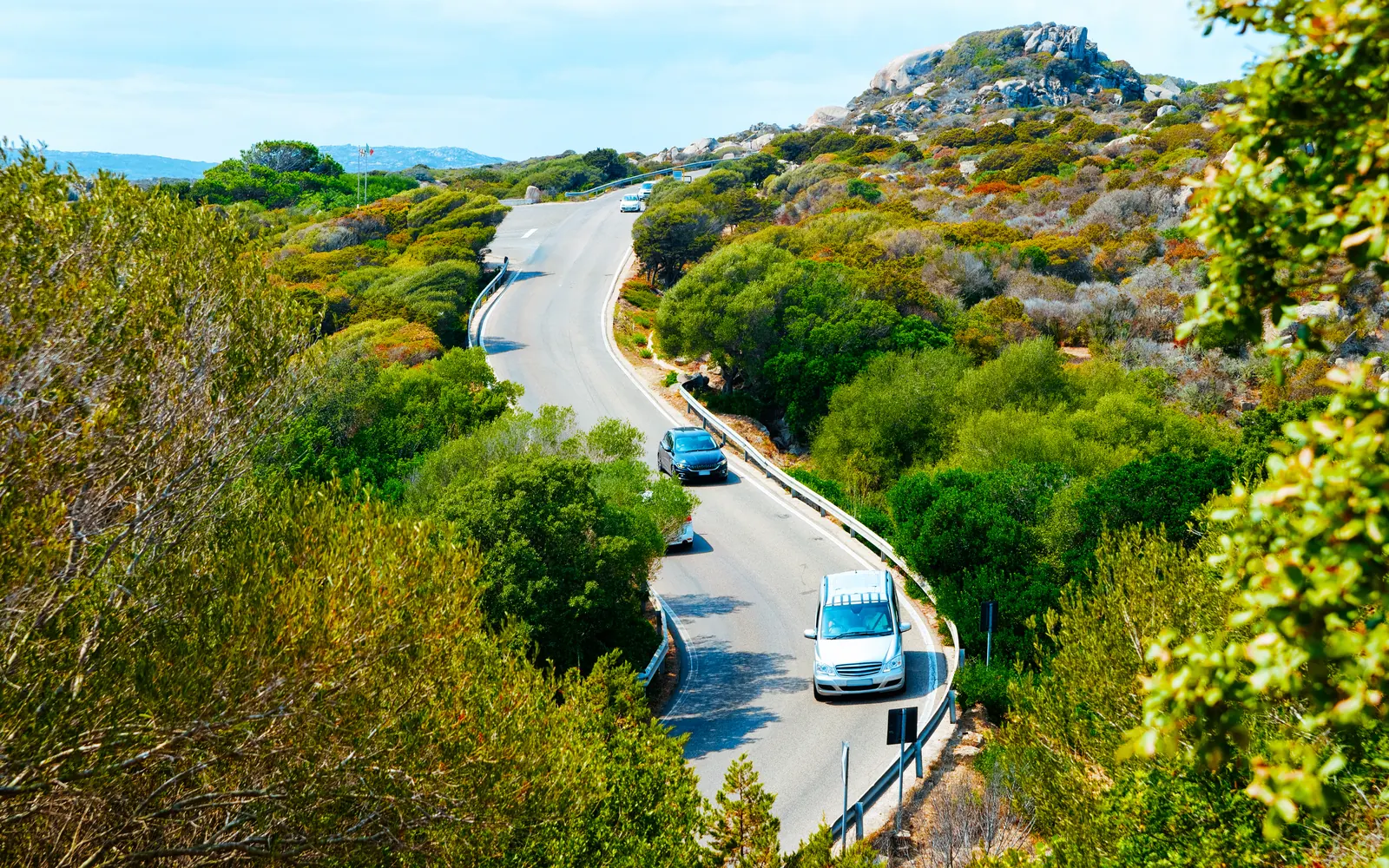 Cars travelling on a coastal road