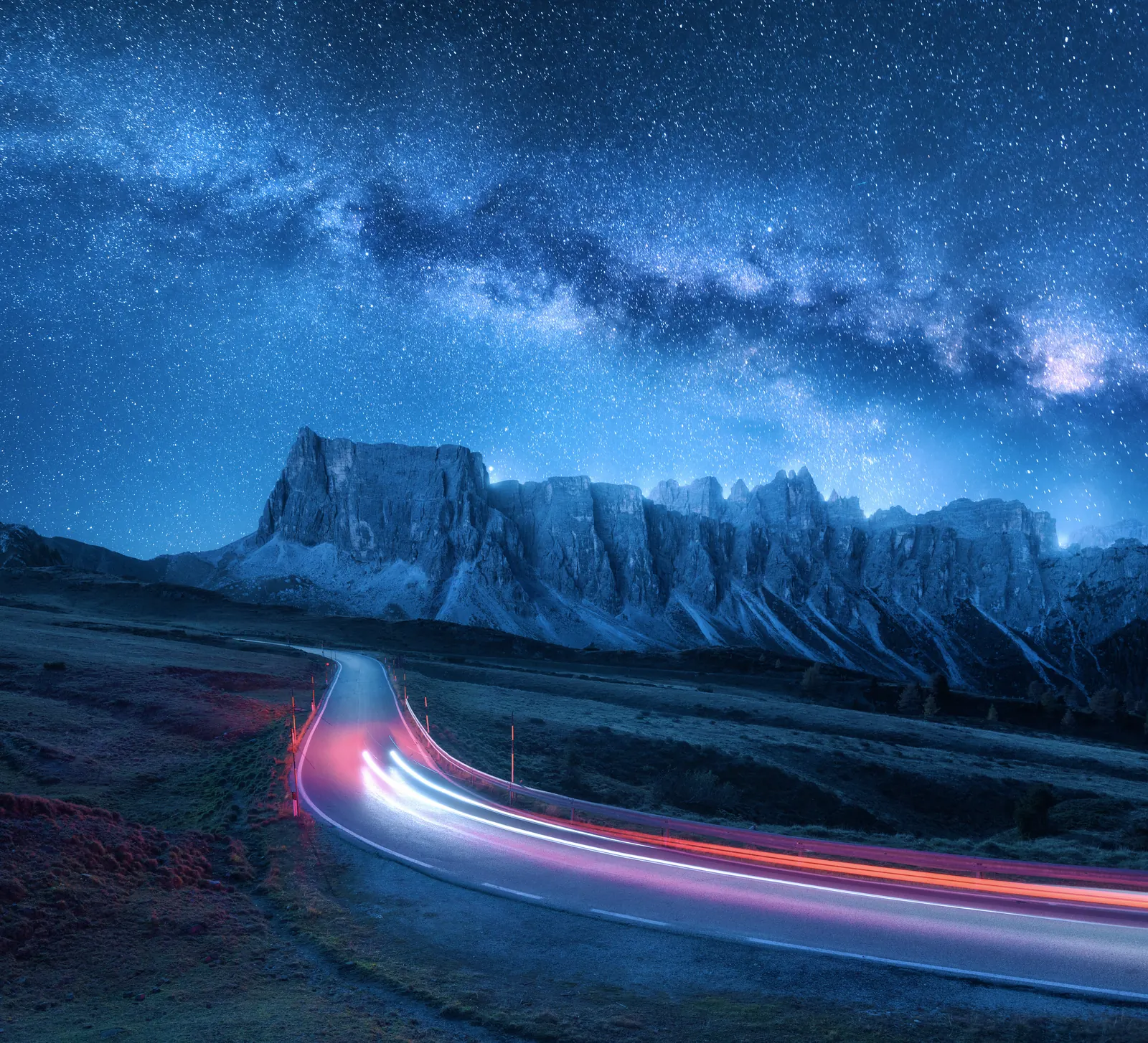 Light trails on a mountain road at night