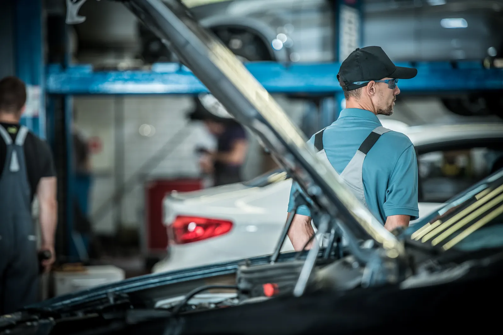 A mechanic working in an automotive workshop